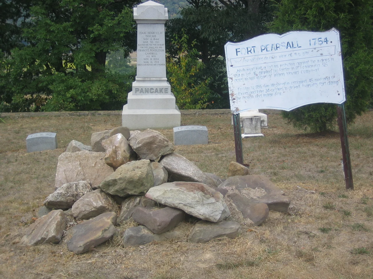 The old Fort Pearsall historical marker in Indian Mound Cemetery in Romney, West Virginia, United States.The faded marker reads:
"Fort Pearsall was on or in view of this site."
"Job Pearsall built a fort as protection against the [I]ndians in 1754 on Lot 16 granted by Lord Fairfax in 1749 containing 325 acres including part of Indian Mound Cemetery."

"On May 14, 1756 Gen. Washington assigned 45 men and 5 officers and later 94 soldiers to defend Pearsall's fort during the French and Indian War."