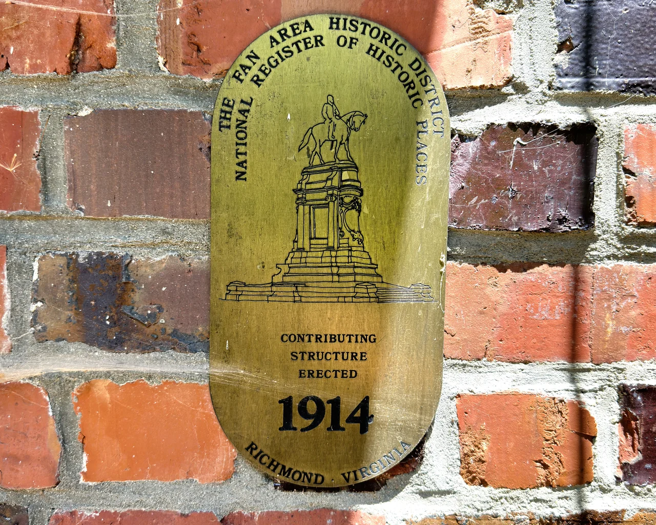 Plaque notating a domicile in Richmond, Virginia as being part of The Fan Area Historic District. This area is part of the National Register of Historic Places. This plaque also notates that the structure it is upon was made in 1914. The photo has had slight digital alteration. I took this photo myself in The Fan in June, 2023. Taken on an iPhone 14 Pro using ProRes imaging.