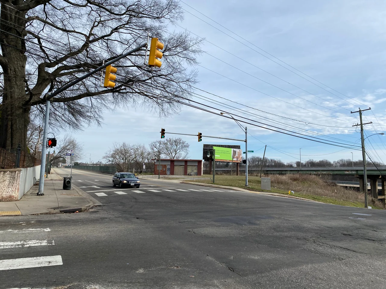The "Shockoe Hill African Burying Ground", established 1816, the heart of which is located at 1305 N 5th St., in the city of Richmond, Virginia. It was established for the interment of free people of color and the enslaved. Visible in the photo is the old Talley's Auto Service Center (formerly a Sunoco gas station) at 1305 N 5th St., which is now owned by the city of Richmond. Also visible are a billboard (on the 1305 N 5th St. property), I-64, 5th St, and the 5th Street Viaduct (Curtis Holt Sr. Bridge). All of these things exist on the Shockoe Hill African Burying Ground. This image shows just a small portion of the 31 acre burial ground site.
On the far left side of the photo is the eastern wall of the Hebrew Cemetery. The Shockoe Hill African Burying Ground extends to the north behind the Hebrew Cemeteries original one acre plat.