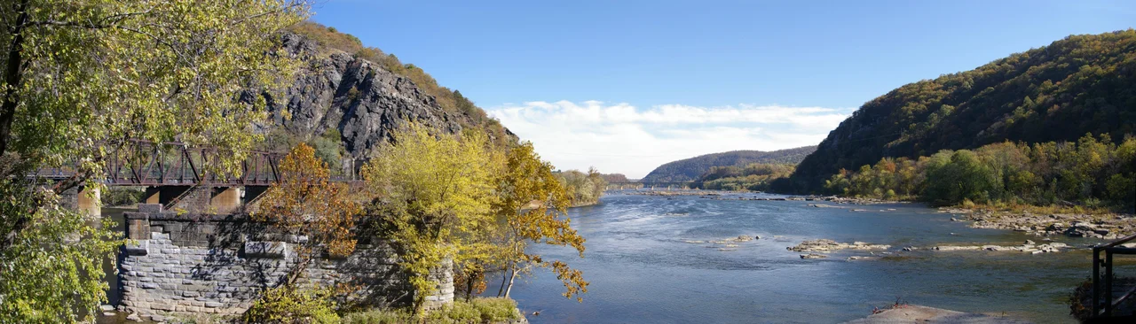 Panoramic photograph of the Shenandoah River (coming from right side) and the 1894 Potomac River railroad bridge in Harpers Ferry, West Virginia, 2007. Photograph by Joy Schoenberger