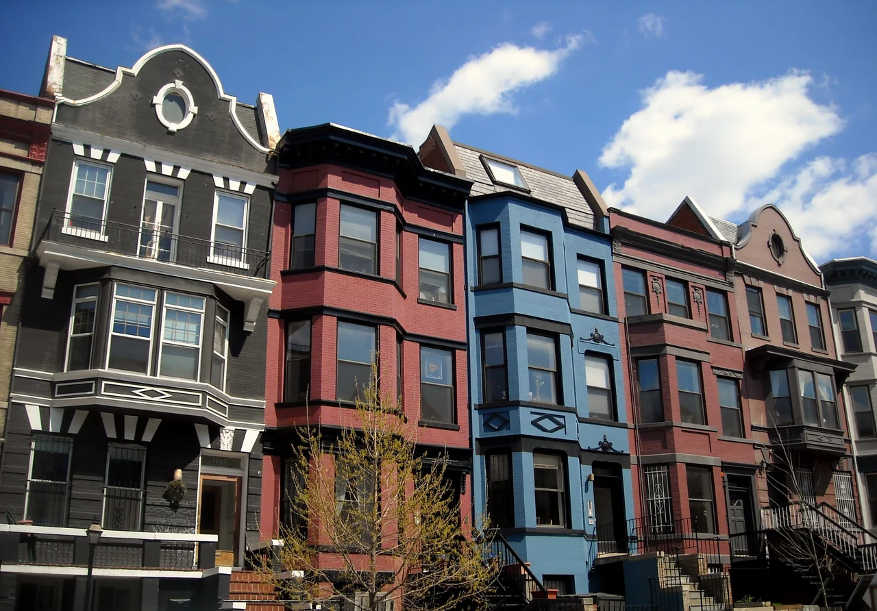 Row houses located at (from right to left) 1861–1869 California Street, N.W., in the Adams Morgan neighborhood of Washington, D.C. Built in 1904, the Queen Anne-style homes are designated as contributing properties to the Washington Heights Historic District, listed on the National Register of Historic Places in 2006.