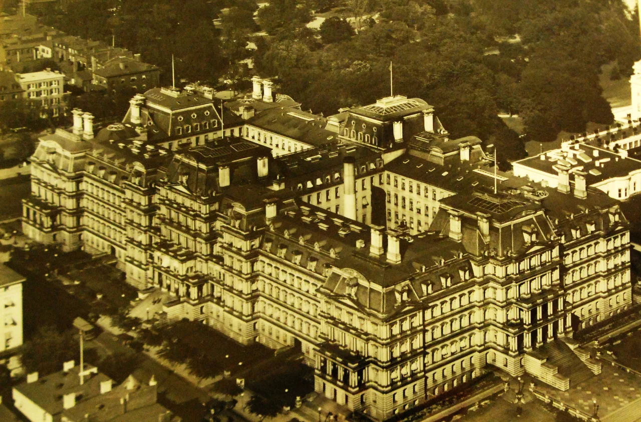 Lot-10181-4: Washington, D.C., aerial view of the State, War and Navy Department Building, Washington, D.C., circa 1920. Note, the White House is to the right. Wittemann Collection. Courtesy of the Library of Congress, also LC-USZ62-56739. Photographed through Mylar sleeve. (2016/11/04).