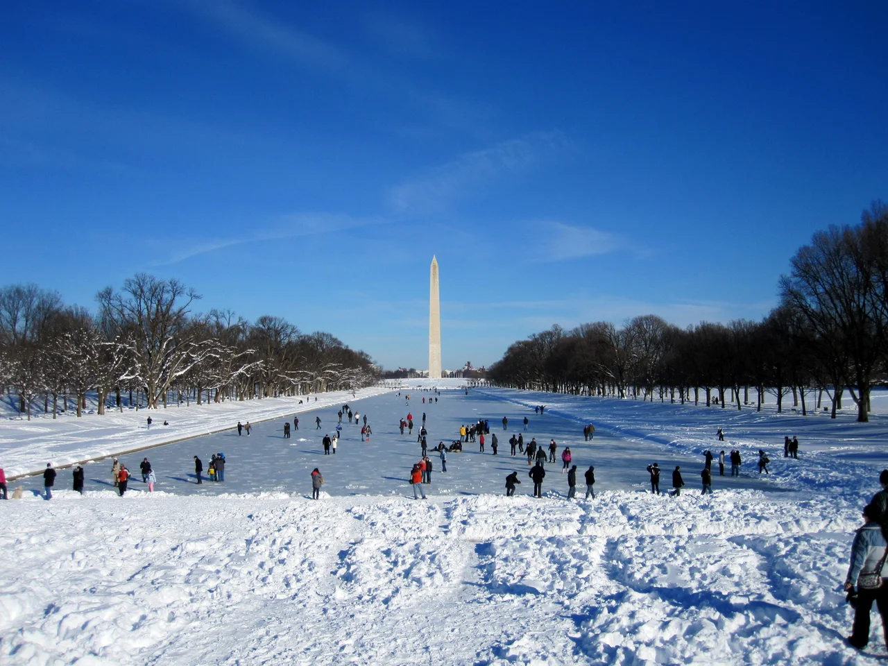 People walking over the ice covering the Lincoln Memorial Reflecting Pool, February 7, 2010, after the First North American blizzard of 2010
