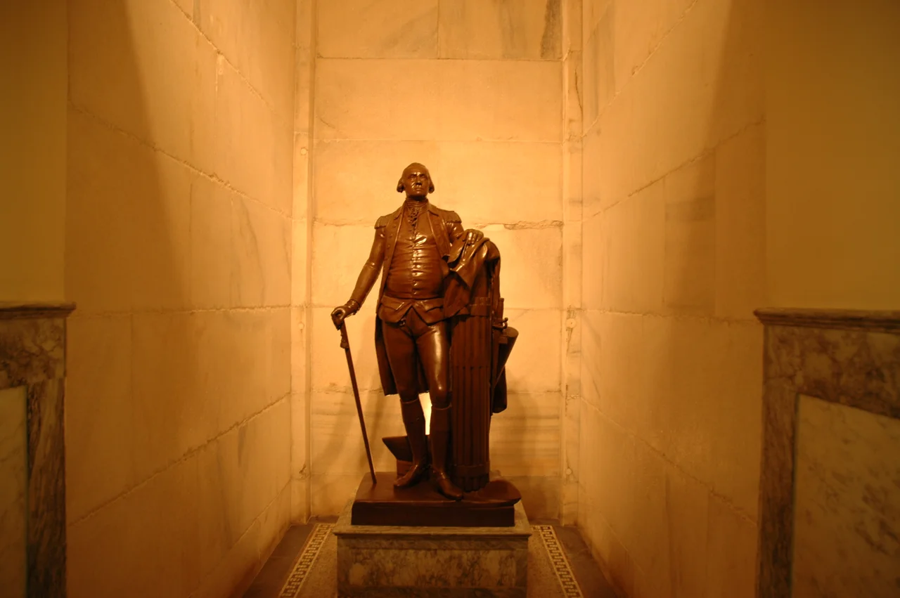 I am the author, and I took this picture inside the monument. The picture is of the George Washington statue next to the bottom floor elevators. I release it to public domain.