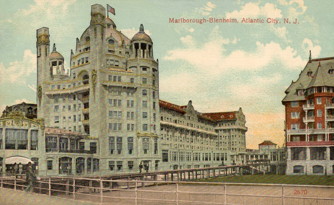 Poster for Pennsylvania Railroad. Atlantic City— America’s All-Year Resort. Painting by Edward Mason Eggleston. Published by the Osborne Company (O Co) of Clifton, New Jersey, shown at bottom right of image. Image includes the Marlborough-Blenheim Hotel over her left shoulder (right side of image).