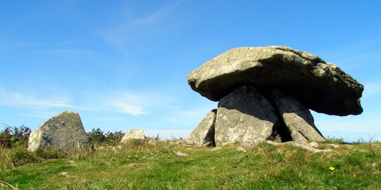 Worms-eye view of the quoit and surrounding stones. It was lunchtime, hence the strong light and shadows.