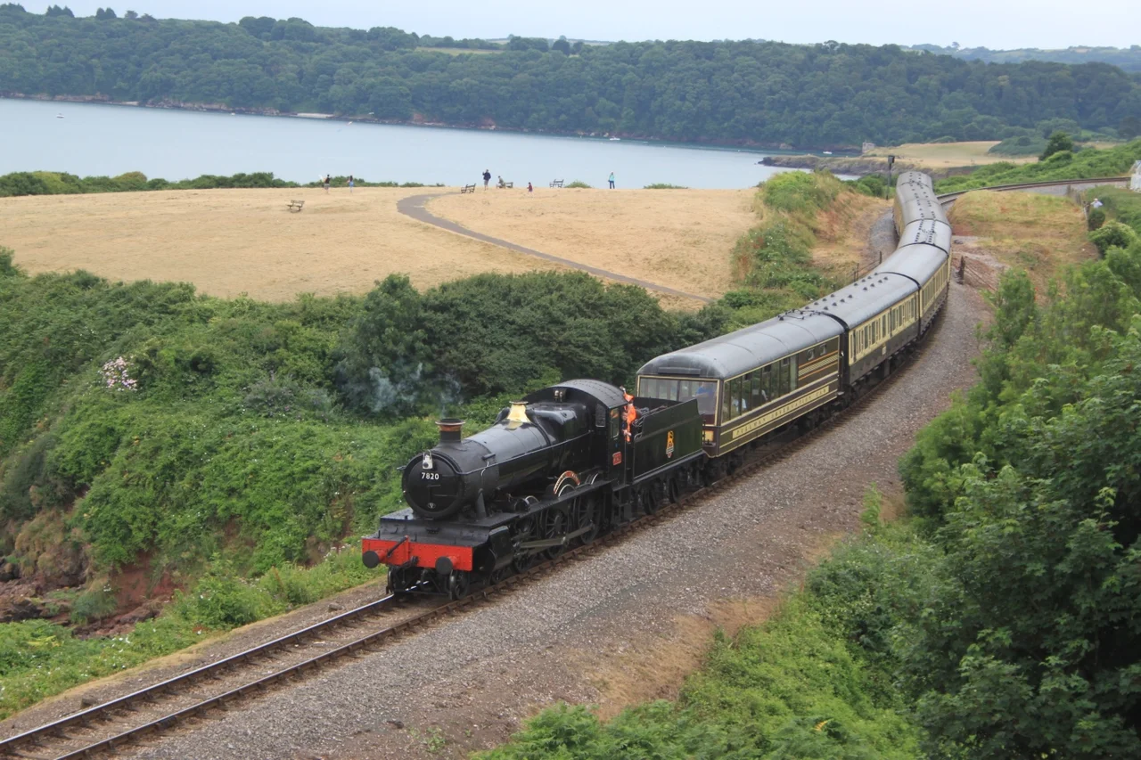 7820 Dinmore Manor spent the summer of 2016 working on the Dartmouth Steam railway. Here it working a Kingswear to Paignton service along the coast north of Churston.