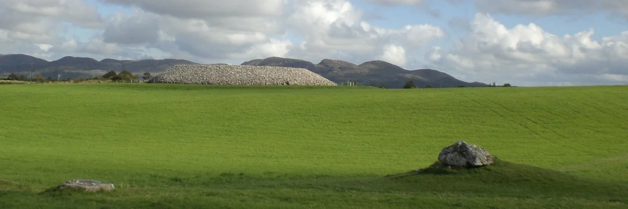 Listoghil, County Sligo, Ireland from the north west with a small satellite tomb, tomb 52, in the foreground.