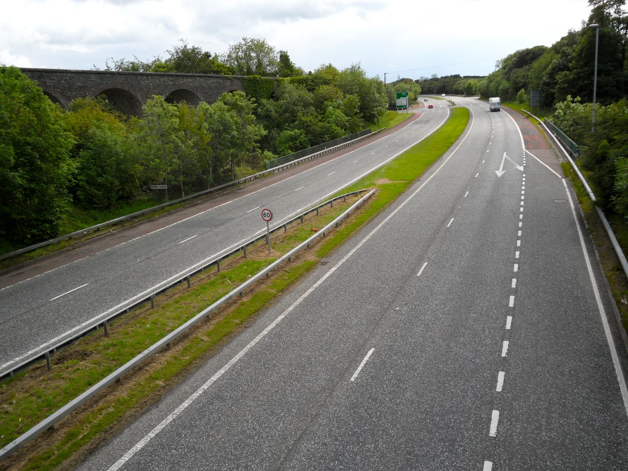 South view over A1 Dromore Bypass, County Down from the Lurgan Road bridge. Road opened 1972, disused railway viaduct to left, bridge over River Lagan in centre.