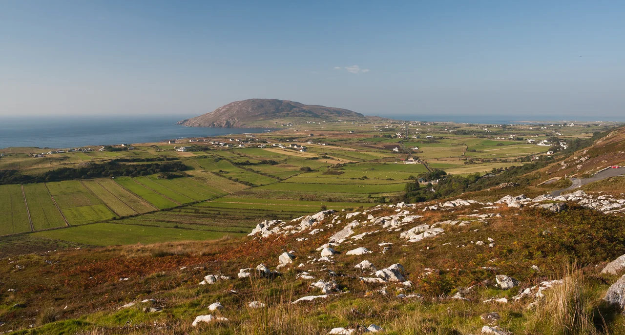 View from Mamore Gap to Urris, a once very isolated area in the north-west of the Inishowen peninsula. The headland in the centre of the picture is Dunaff Head.