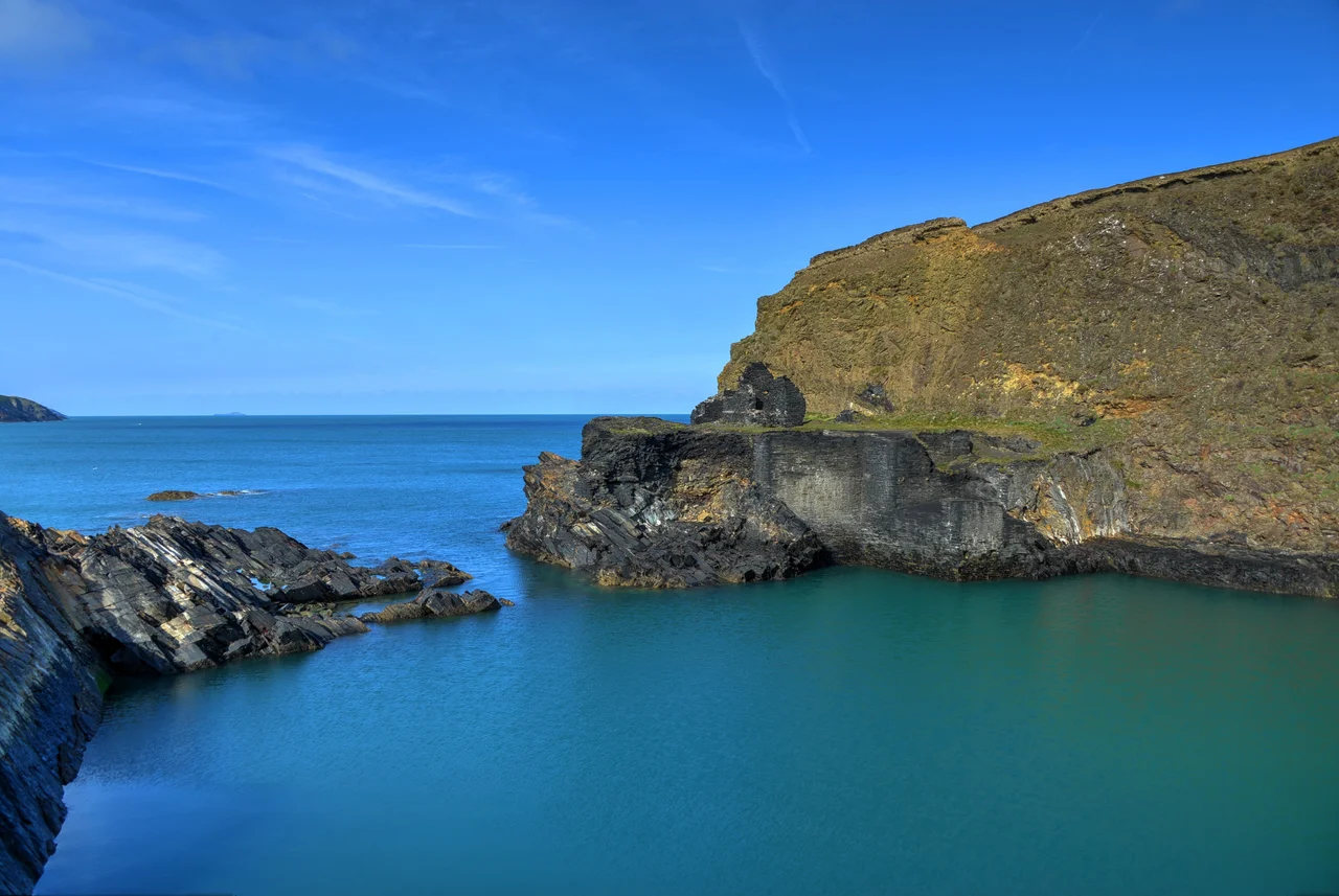 The Blue Lagoon, an old slate quarry now inundated by sea water. The lagoon water is colored differently from the sea water due to the minerals in the old quarry.