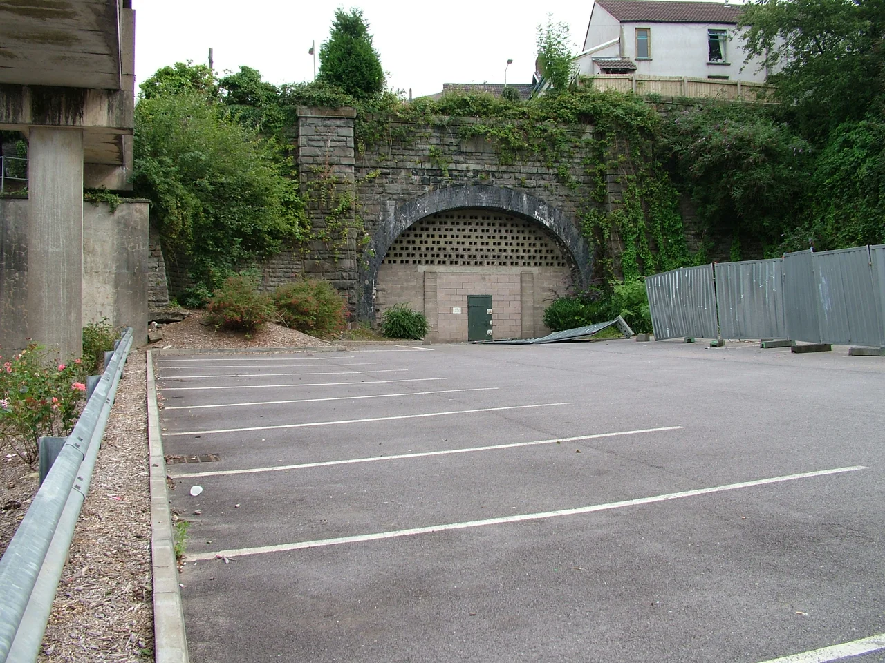 The tunnel mouth of Pontypridd Graig Station, in the car park of Dewi Sant Hospital