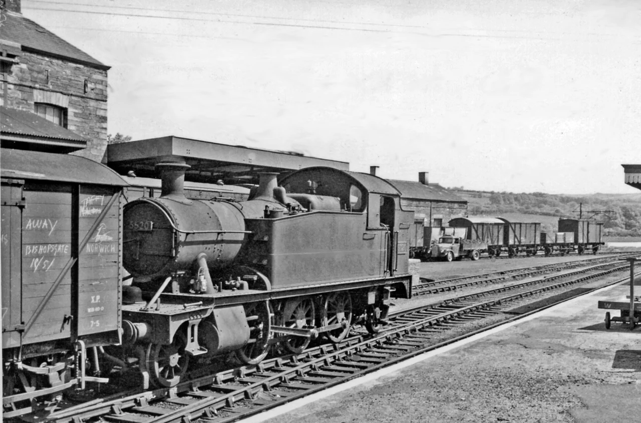 A '4575' 2-6-2T with goods train at Cardigan station.
View eastward, towards Whitland at the terminus of the ex-GW branch from Whitland. The branch was closed for passengers on 10/9/62, to goods on 27/9/63, but there seems to have been plenty of traffic around here in 6/1962. The locomotive is No. 5520 (built 12/27, withdrawn 9/62).
