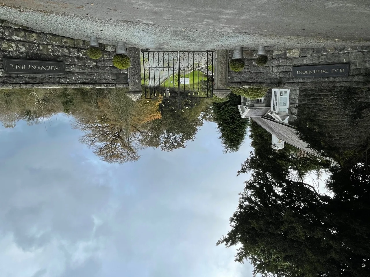 Gates entering a private road to a hall's estate in Gwynedd, Wales.