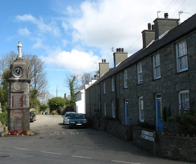 Crown Terrace facing the square at Llanfechell In the old days the square at Llanfechell, or Llanfachell in the local dialect, was the scene of hiring fairs. Here, farm labourers would wait to be hired for the season by farmers.