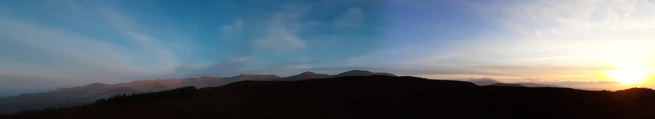 Carneddau mountain range panorama, seen from the top of Moel-y-Ci, at sunset