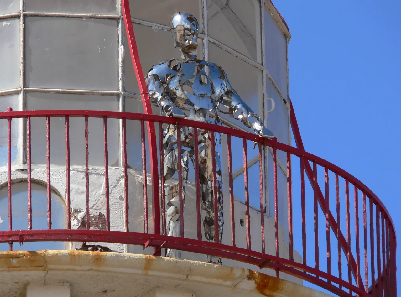 'The Keeper' at the Point of Ayr Lighthouse. The 'The Keeper' is a 7ft stainless steel sculpture by artist Angela Smith.
It is said to represent all the ghost sightings at the lighthouse. One of which is of the keeper, who stands on the upper walkway.