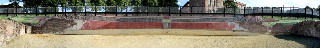 hand painted trompe l'oeil mural in Chester's Roman amphitheatre by Gary Drostle. Photograph taken on day of completion showing panorama of 50 metre wall.