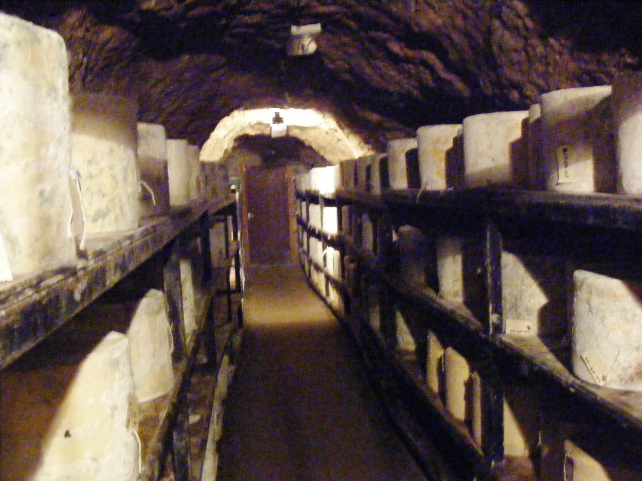 Cheeses being stored and matured at Wookey Hole Caves