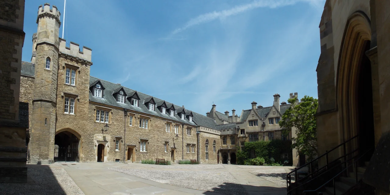 Panoramic view of Front Quadrangle, Merton College, with the main entrance to the College (on the left), the arcades of access to St Albans Quadrangle (in the middle), and the entrance to the College Hall (on the right).