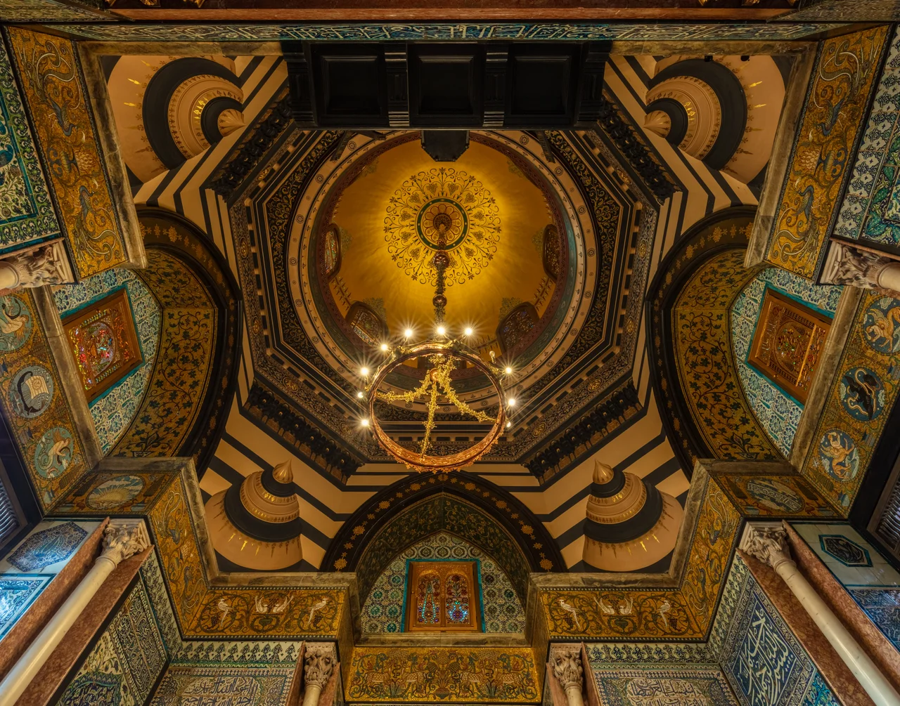 Ceiling of the Arab Hall at Leighton House, Royal Borough of Kensington and Chelsea, west London, England. The hall is for many the center piece of the whole artist home and shows Leighton's fascination with the Middle East, that he often visited. The construction started in 1877 and took 4 years to complete. The art museum and historic house is located in the Holland Park area and was the London home of painter Frederic Leighton, 1st Baron Leighton (1830–1896), who commissioned the architect and designer George Aitchison to build him a combined home and studio. The resulting building, noted for its elaborate Orientalist and aesthetic interiors, has been open to the public since 1929. The museum was awarded the European Union Prize for Cultural Heritage / Europa Nostra Award in 2012.