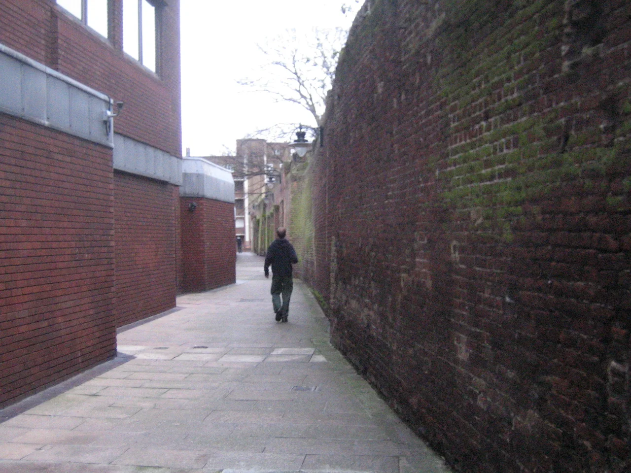 Angel Place, London. The remaining wall of the Marshalsea prison can be seen on the right. To the left is Southwark's Local Studies Library at 211 Borough High Street, Southwark, London SE1.
Source: [1]

Author: User:LoopZilla