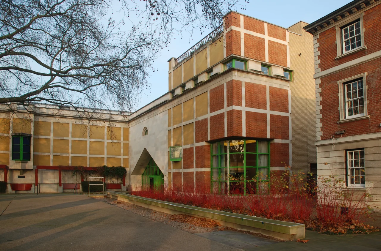 Clore Gallery London, built as an extension of Tate Britain (1980-87). Design by architect James Stirling. Photo taken from the East (Thames River side), in winter, at sunrise.