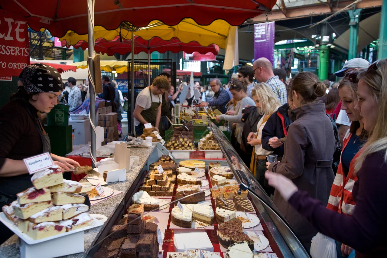 A cake stall in busy Borough Market on a Saturday afternoon in London, England. Taken by myself with a Canon 5D and 24-105mm f/4L IS lens.