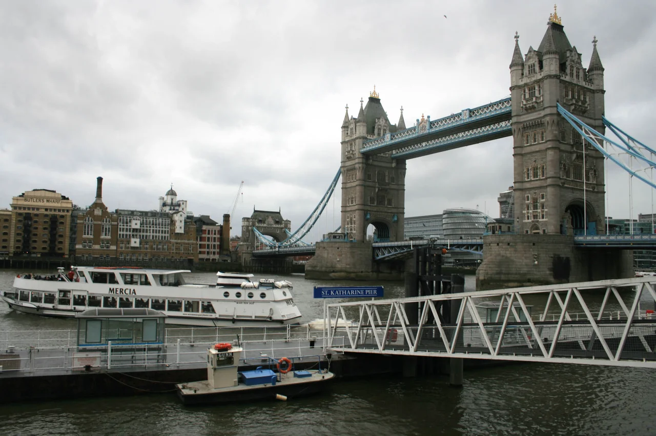 The MV "Mercia" departs from St Katharine pier on the River Thames, London, UK, with Tower Bridge in the background.
