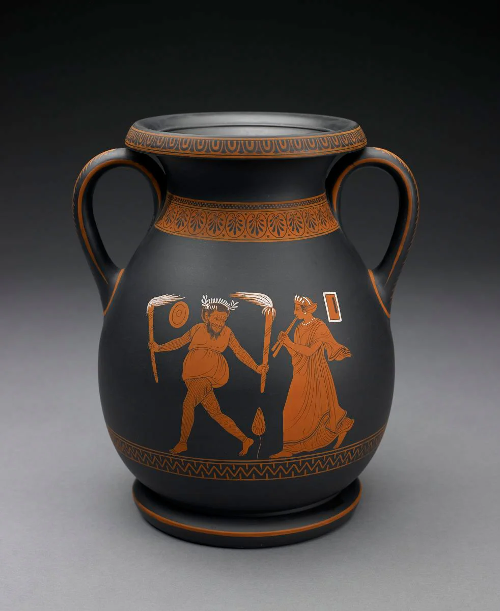 A black basalt vase from Wedgwood featuring red figures.