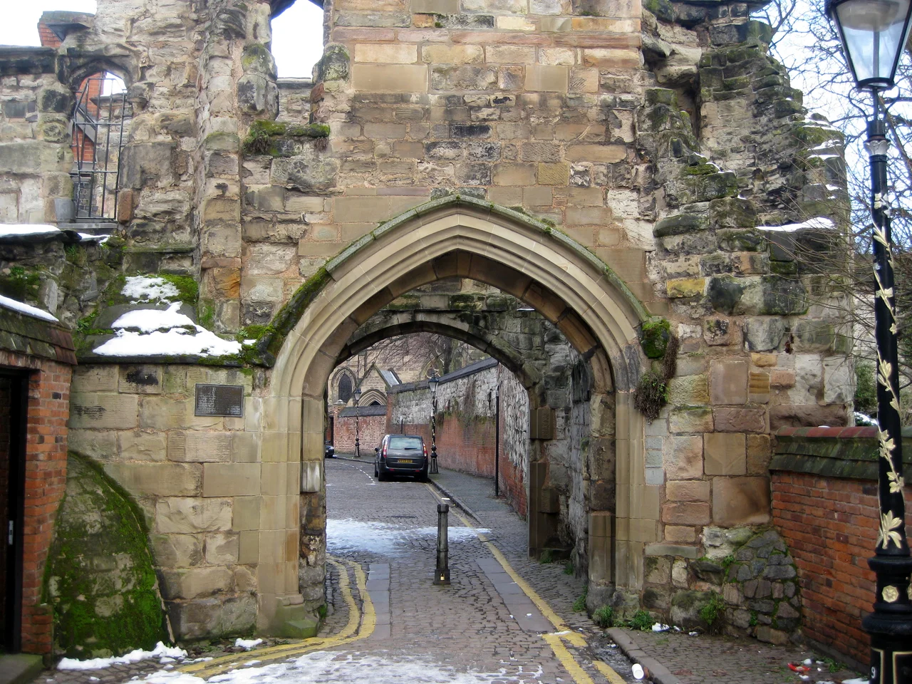 Looking north through the Turret Gateway near Leicester Castle. The gateway is Grade I listed