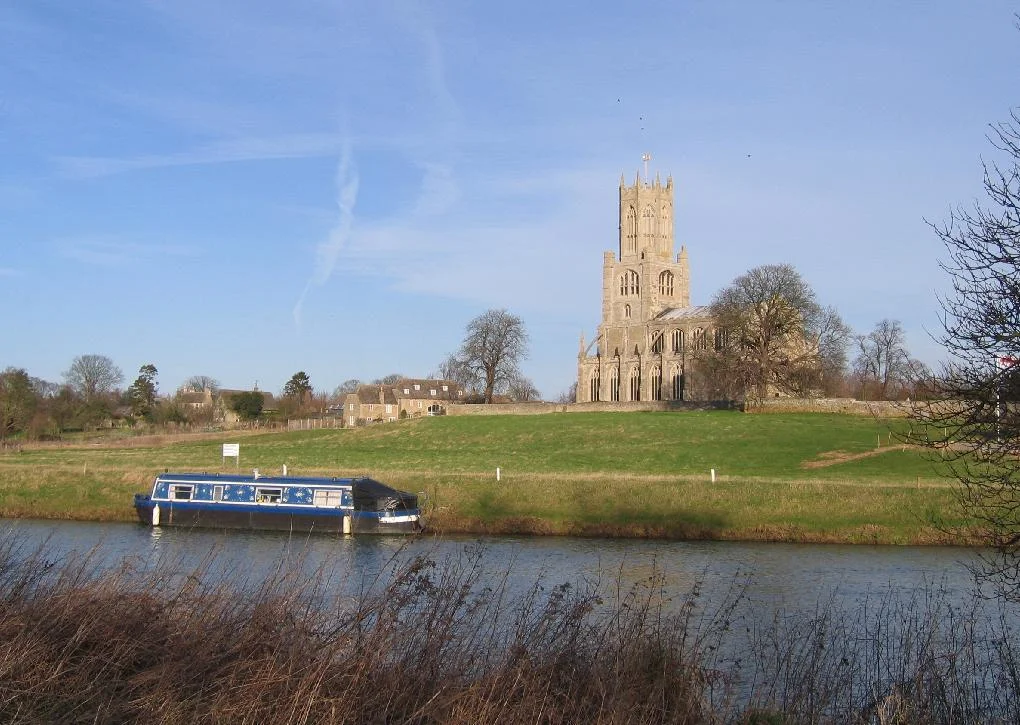 The church of St. Mary and All Saints in the village of Fotheringhay (Northamptonshire) looking north across the River Nene.