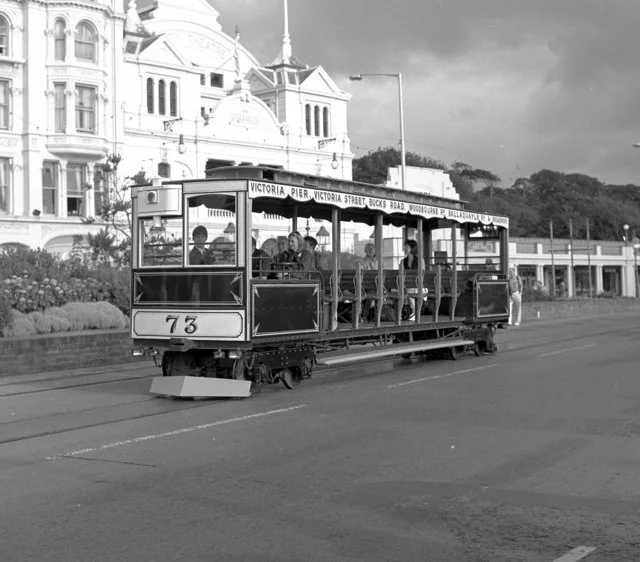 Cable car on Douglas Promenade The ex-cable car runs along the horse-car tracks along Douglas Promenade, powered by batteries.