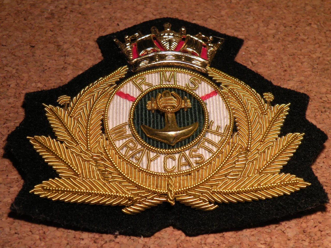 Cap badge of RMS Wray Castle, Merchant Navy Radio Officer Training College