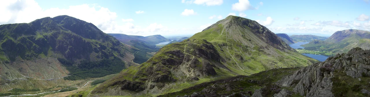 This photo depicts the view of: High Crag, Pillar, Buttermere and Crummock Water from Haystacks