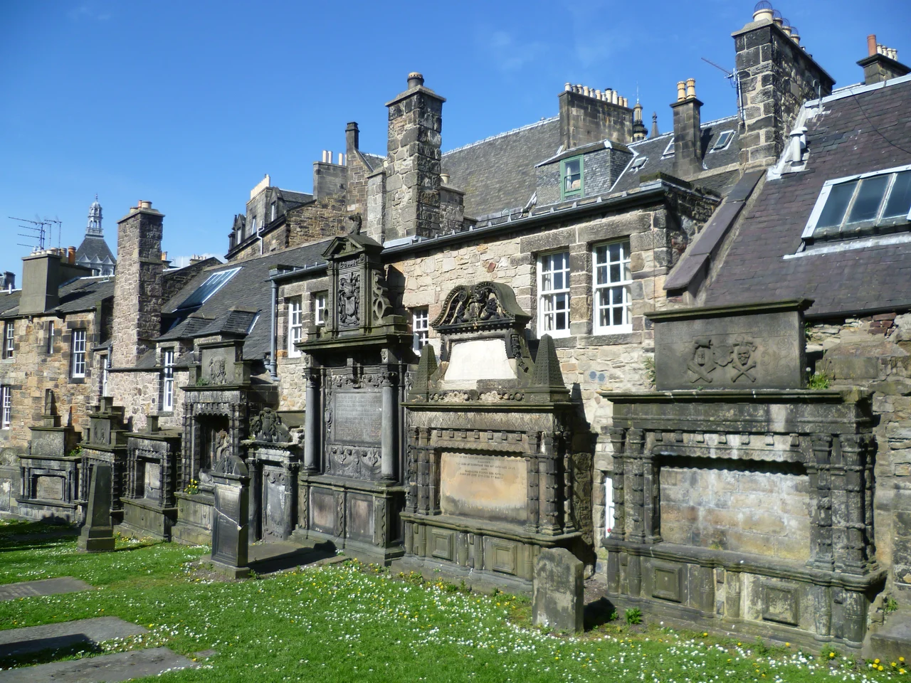 Monuments on the east wall of Greyfriars Kirkyard. The main entrance to the kirkyard in the Cowgate formerly bore the inscription,
Remember Man, as thou goes by,
As thou art now, so once was I;
As I am now, so thou shalt be;
Remember Man, that thou must die. [pronounced 'dee' in Scots]
