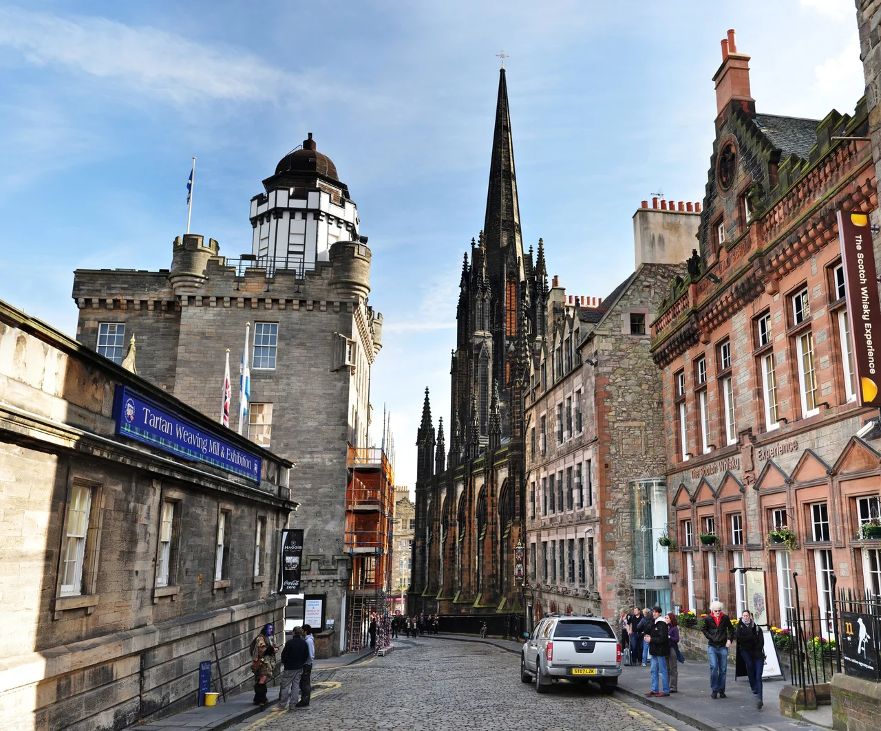 Castlehill forming part of the Royal Mile. In the center is The Hub, housing an information service for the Edinburgh International Festival. On the right is The Scotch Whisky Experience. On the left is the Camera Obscura and shops. Photo by Gregg M. Erickson