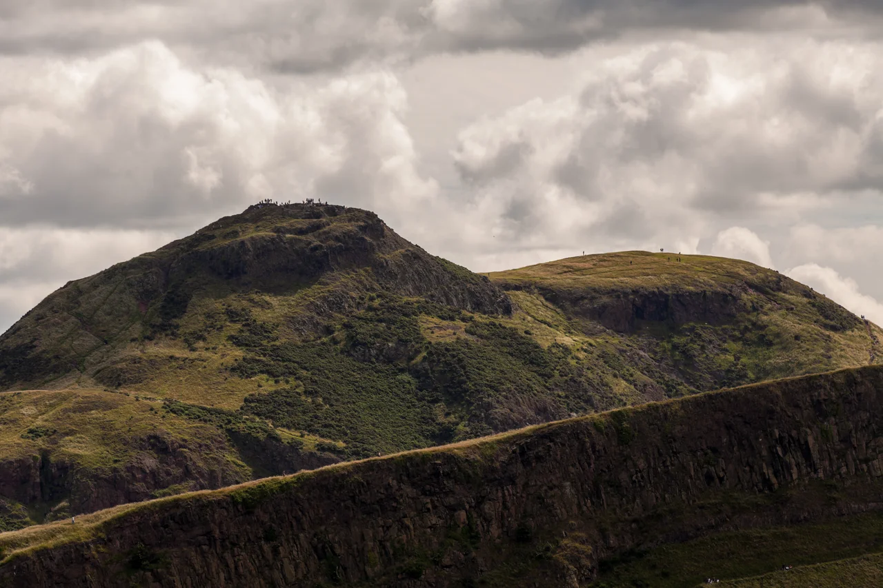 360 degree panorama taken from the summit of Arthur's Seat in Holyrood Park, Edinburgh, UK. Edinburgh Castle is visible in the distance.