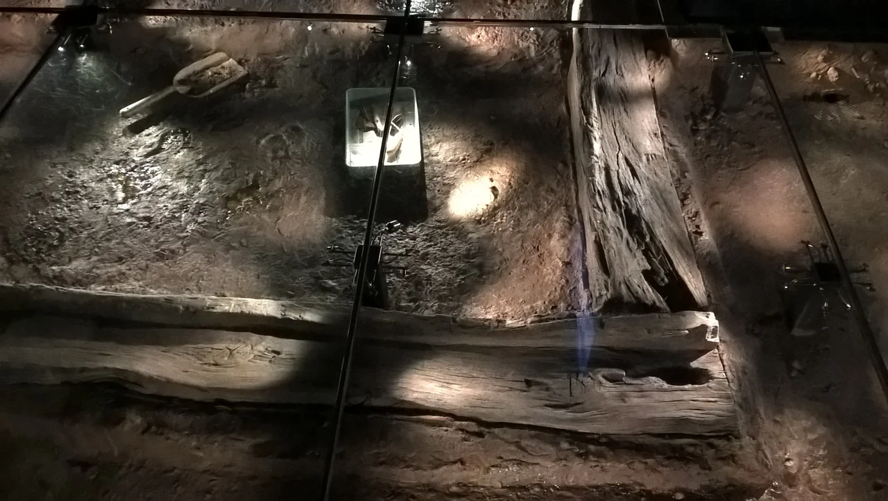 Under the glass floor at the Jorvik Viking centre is a reproduction of the archeological site.  The timbers are actual ones found here, but the soil and water are artificial to look as it was.