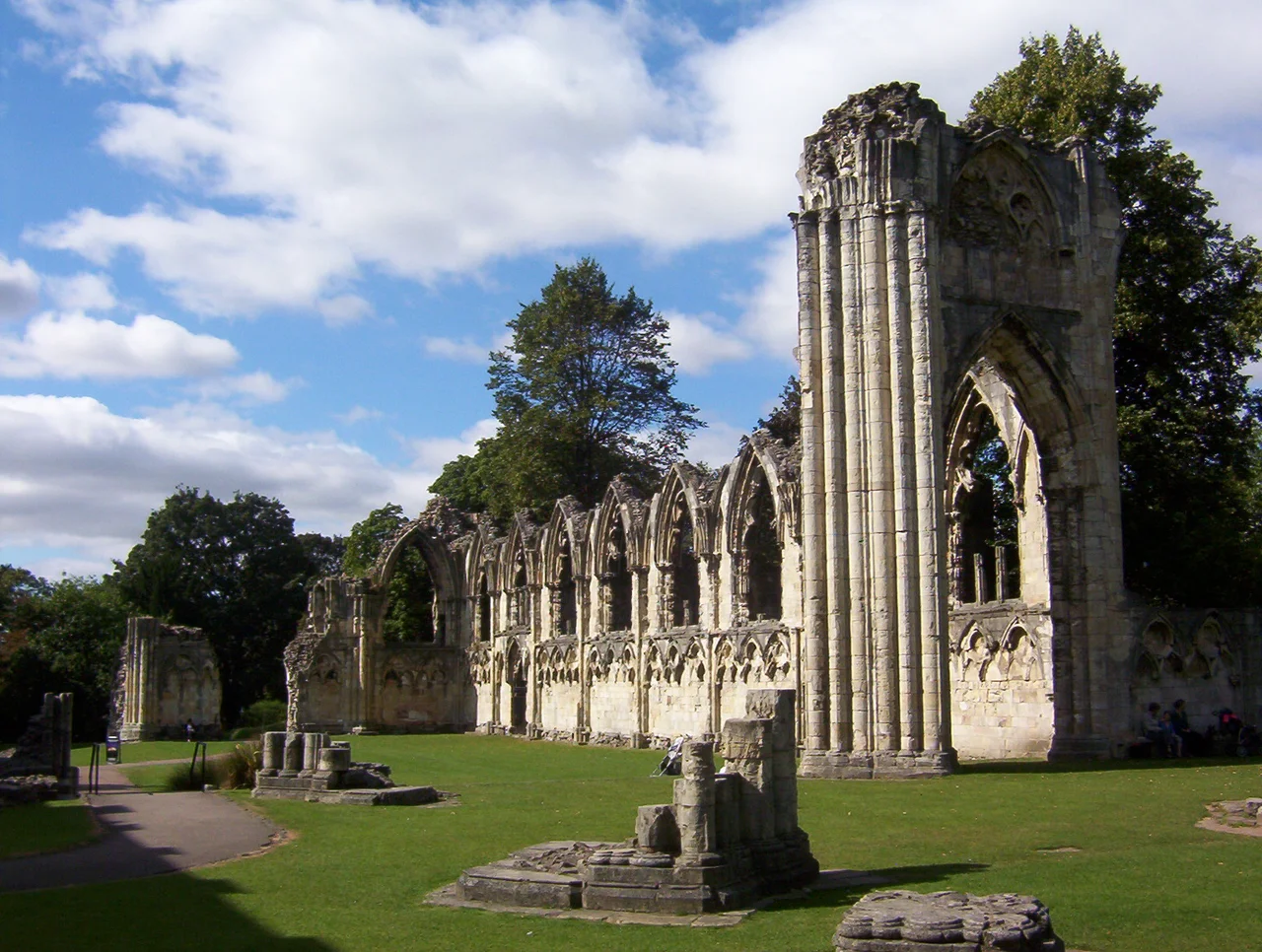 St Mary's Abbey Church in Museum Gardens York, England. This shows the ruins of part of the north and west walls that formed the nave and crossing, designed in Gothic style by architect Simon of Pabenham in the 13th century, between between 1270 and 1279.