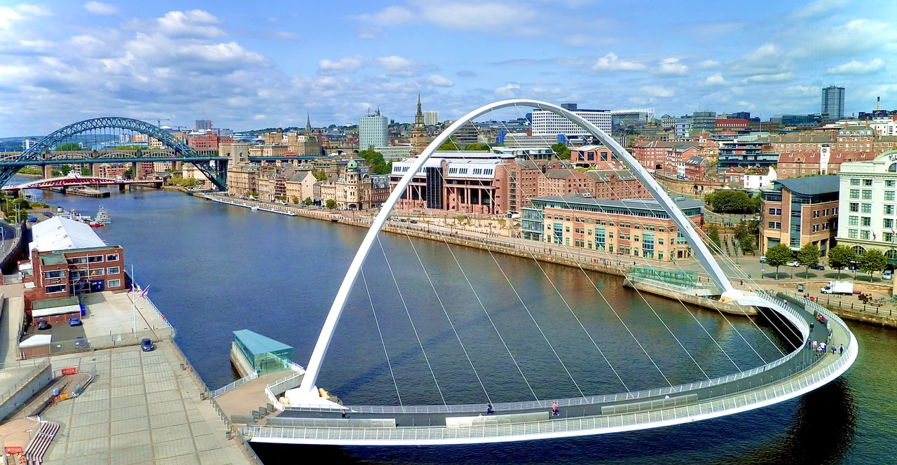 The Tyne bridges, including the Tyne Bridge and the Gateshead Millennium Bridge, with the skyline of Newcastle upon Tyne in the background, as seen from the Baltic Gallery, Gateshead.