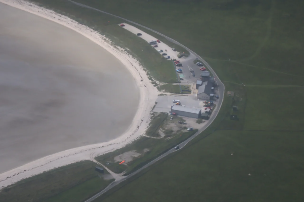 Barra Airport from above onboard a departed Loganair Twin Otter