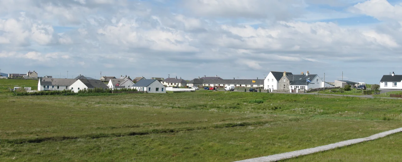 The village of Carinish (North Uist) with the battlefield of Carinish in the foreground.