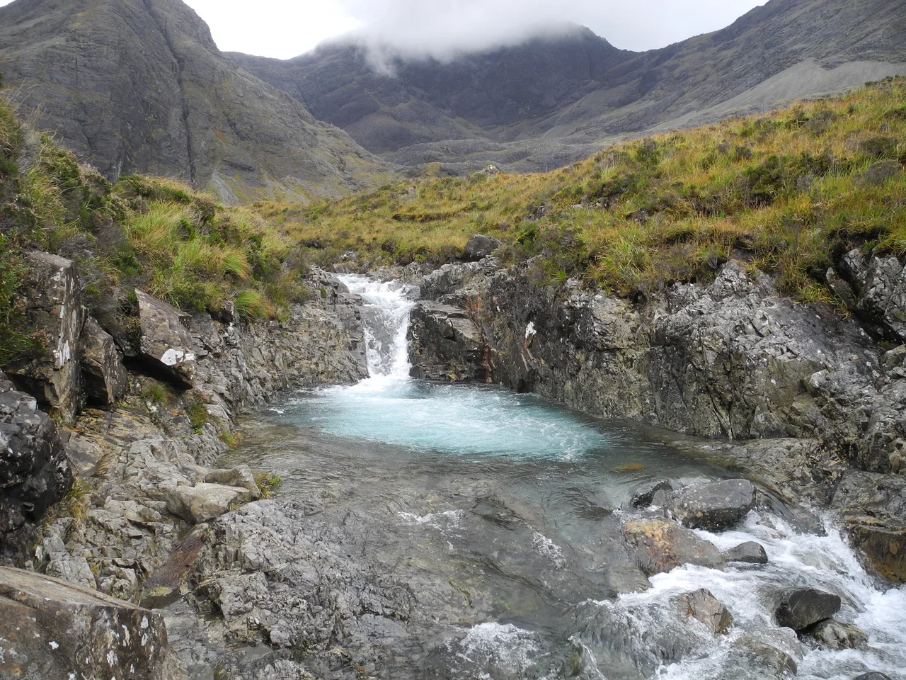 Facing upstream. (I believe the mountains in the background are Bruach na Frithe and Sgùrr na Banachdaich, but this needs to be confirmed.)