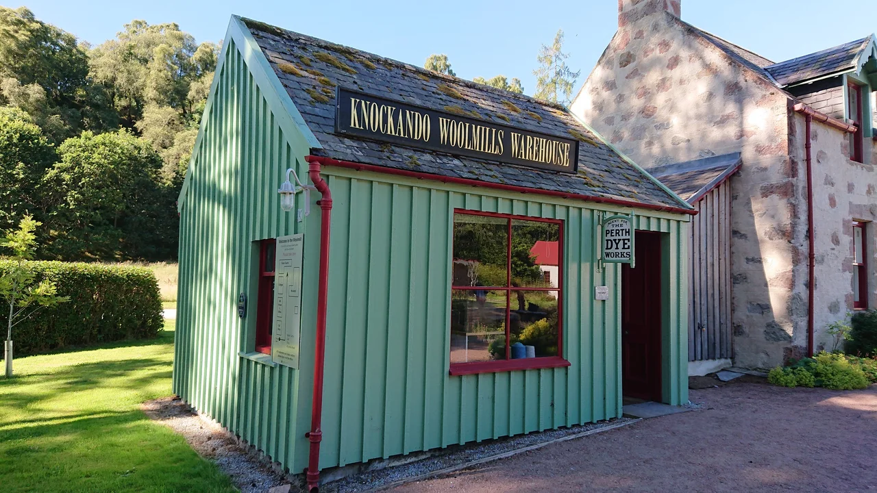 The old shop at the Knockando Woolmill. It now houses some historic equipment, and displays some of the mill's produce; the mill's shop is currently in a different part of the complex.