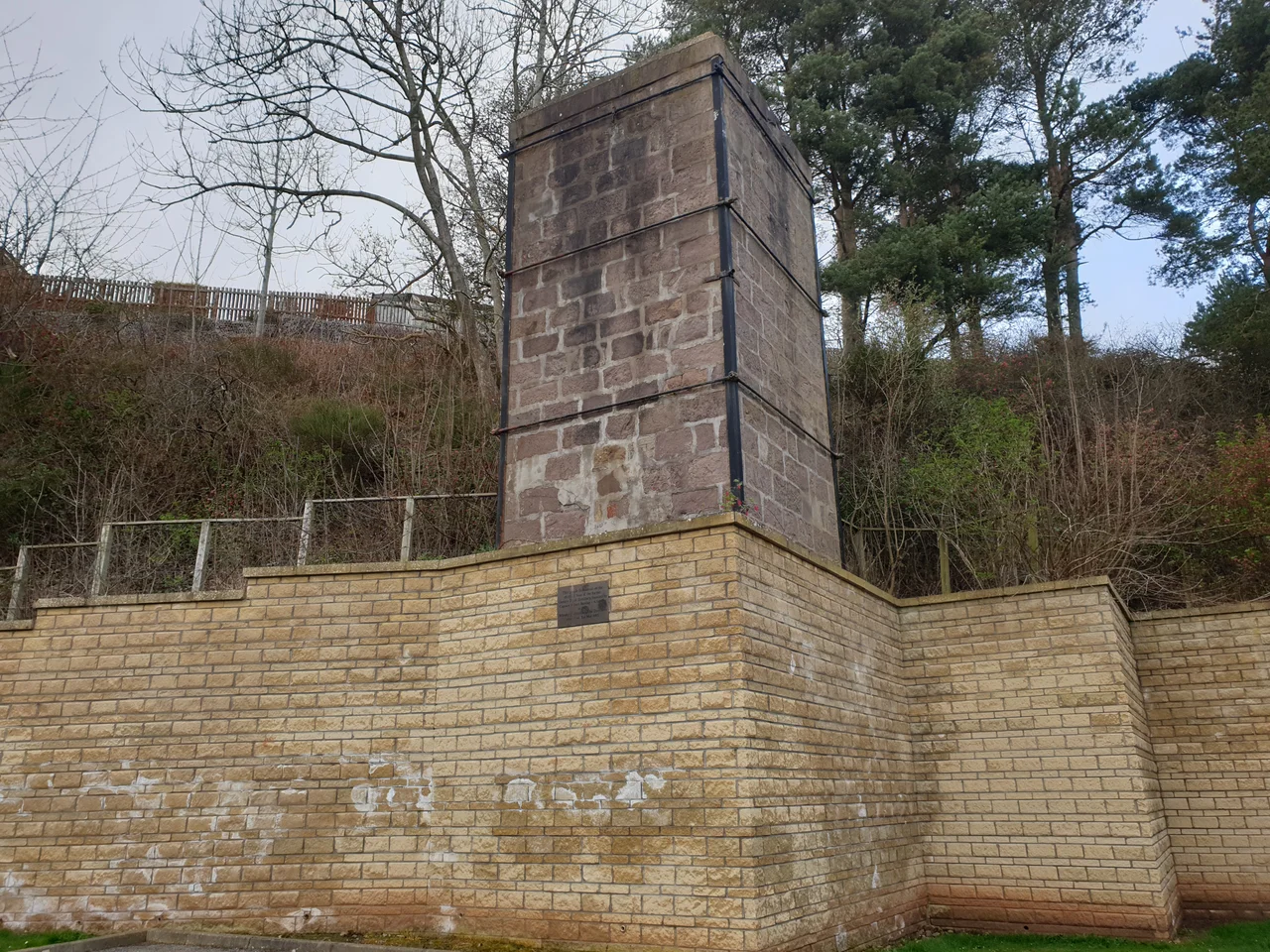 Preserved chimney base from Glenury distillery, now within a housing estate.