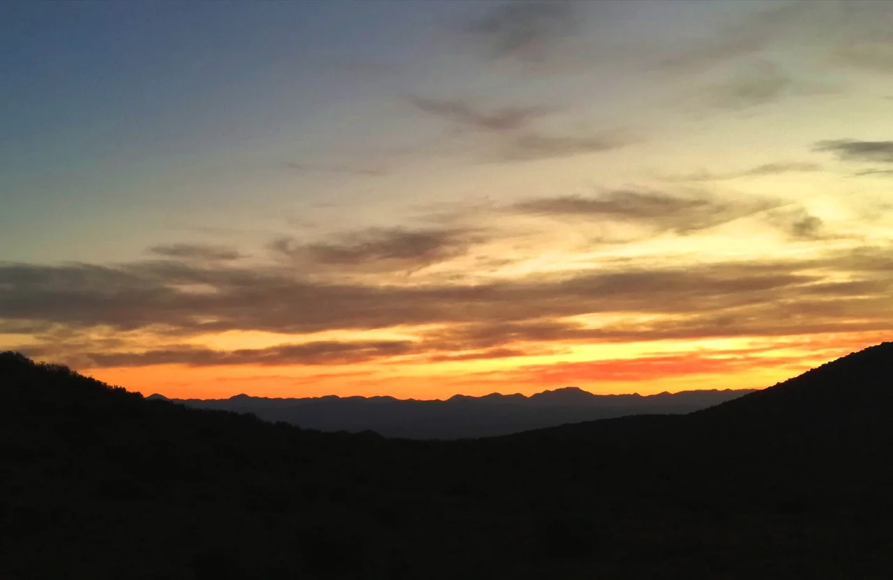 Sunrise as seen from balcony of holiday cabin in Gamkaberg Nature Reserve