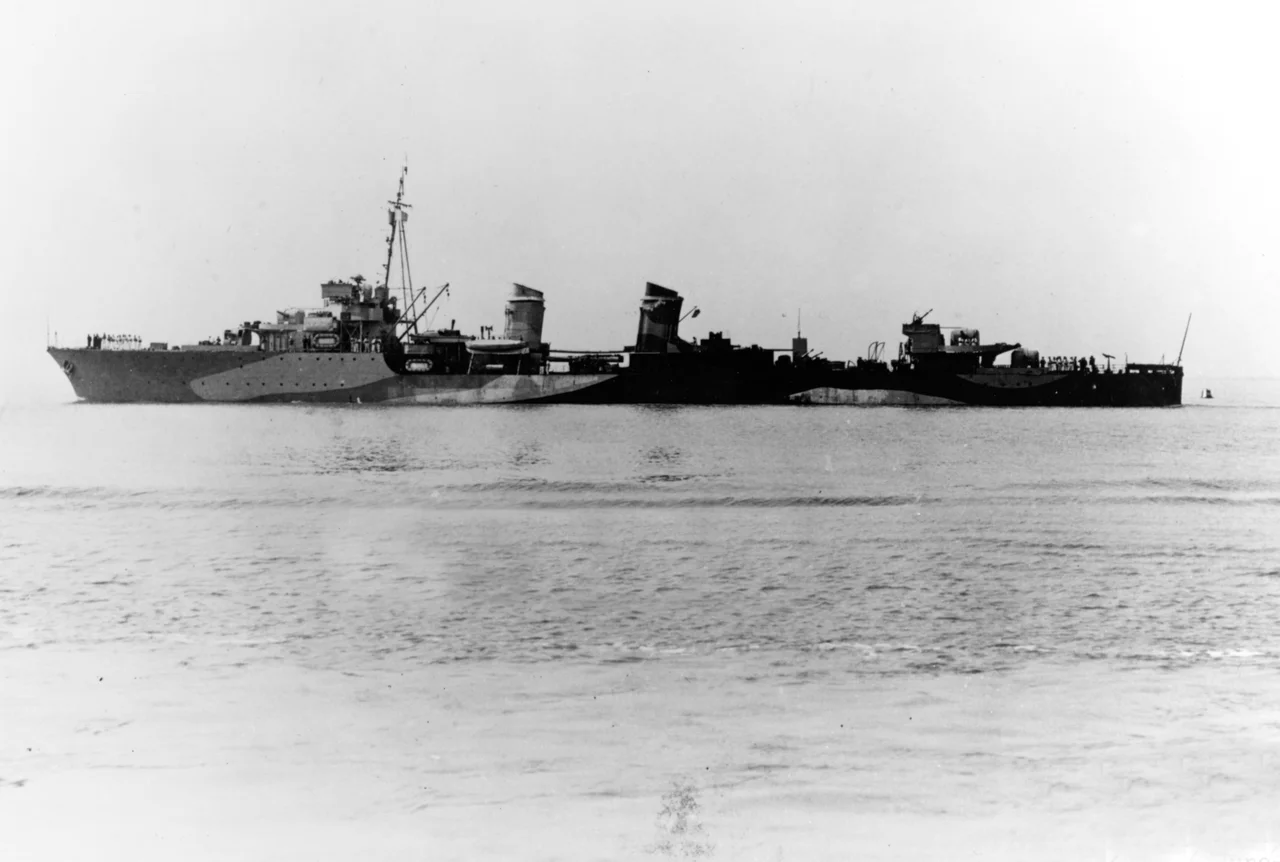 The Free French destroyer Léopard on 6 June 1942, following refit in the United Kingdom in which her forward stack and boilers were removed, fuel stowage increased and additional anti-aircraft guns fitted. Note her British-style pattern camouflage.