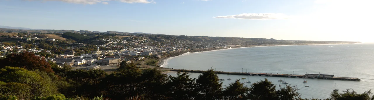 Early morning panorama of Oamaru and coast to the north.  Stitched with Hugin from three original photographs.