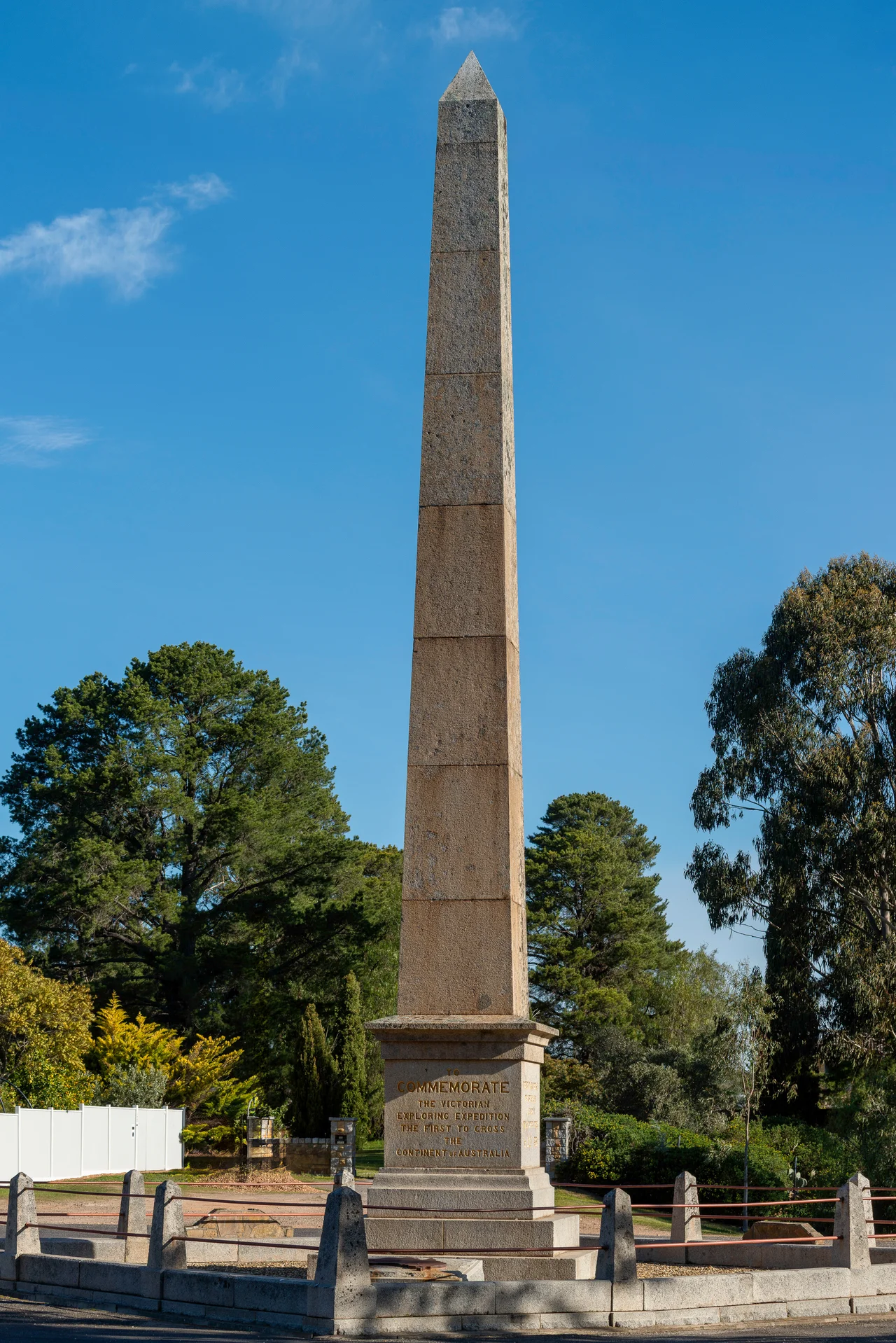 The Burke and Wills expedition monument in Royal Park with the city skyline in the background.